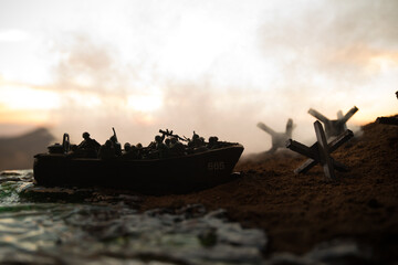 World War 2 reenactment (D-day). Creative decoration with toy soldiers, landing crafts and...