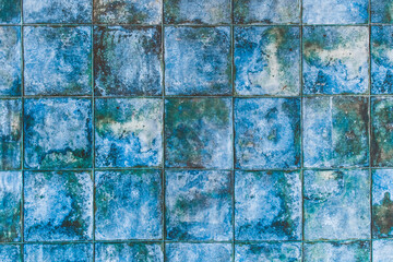 Blue mosaic ceramic tiles with abstract pattern texture background in modern interior