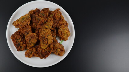 
Fritters is an easy snack recipe which is prepared with gram flour, onions and spices.
