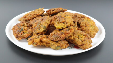 
Fritters is an easy snack recipe which is prepared with gram flour, onions and spices.
