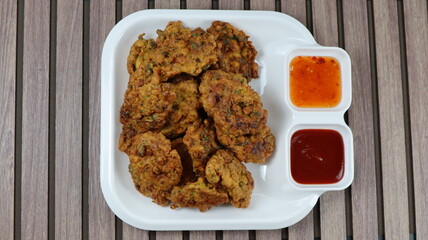 
Fritters is an easy snack recipe which is prepared with gram flour, onions and spices.
