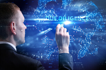 Business, Technology, Internet and network concept. Young businessman working on a virtual screen of the future and sees the inscription: Due diligence