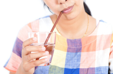 A girl drinking from a straw