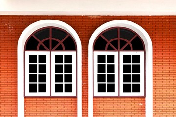 Two white wooden window frames isolated on a black background