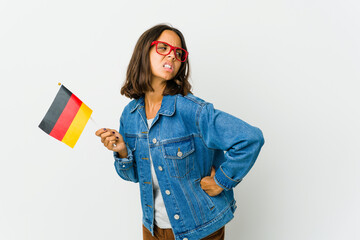 Young latin woman holding a german flag isolated on white background