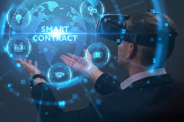 Business, Technology, Internet and network concept. Young businessman working on a virtual screen of the future and sees the inscription: Smart contract