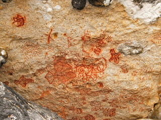 Authentic Arawak or Carib rock paintings in cave on a Caribbean island.