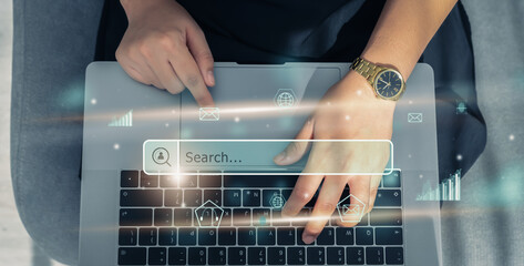 Hand using laptop and press screen to search Browsing on the Internet online.