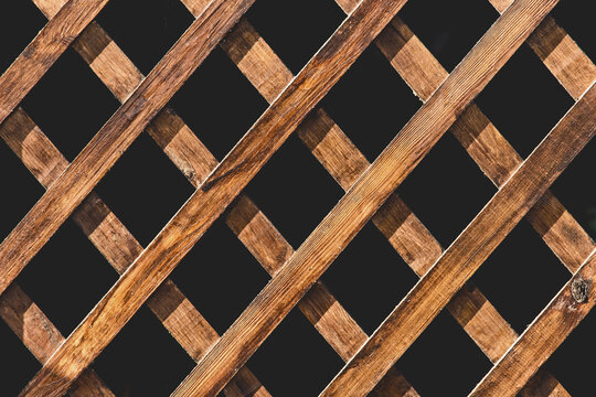 Wooden decorative mesh gazebo interior pattern texture on black exterior background
