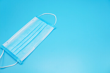 Mask for the prevention of various pathogens and, coronavirus Isolated on a blue background
