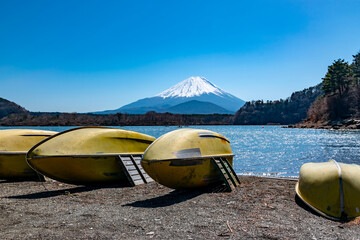 boats by lake shojiko and mt fuji