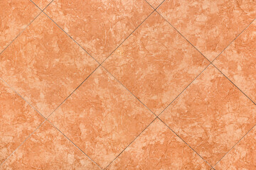 Orange or brown ceramic floor tiles with abstract texture background pattern, top view