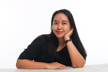 Young Asian woman with no make up on white background.