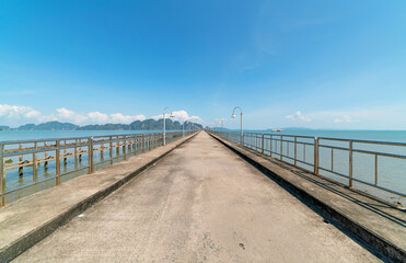 The long bridge in to the sea with beautiful nature view at phang nga Thailand Concept travel background and tour in summer season.travel  website background