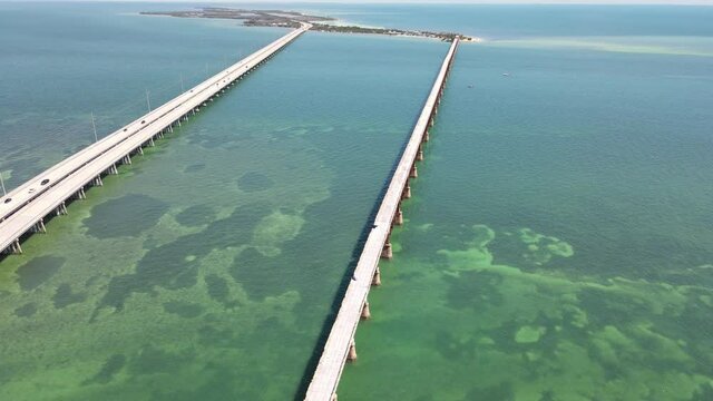 Old Bahia Honda Railroad bridge showing the damage of the most recent hurricane.  Concrete chunks are missing in most sections