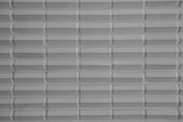 white gloomy tiles on the bathroom wall in the hotel bedroom