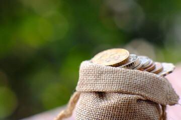 Stacks of gold money coin on table background and concept saving money, business growth strategy of money concept, advertising coins of finance and banking