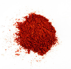 Heap red chili powder or paprika on a white background, top view