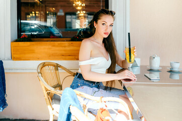 Young glamour sexy woman posing with juice