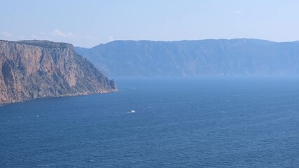 Beautiful view of the coast of the turquoise sea at Cape Fiolent, Crimea. The concept of tranquility, silence and unity with nature