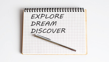 Word Writing Text EXPLORE DREAM DISCOVER on notepad . business concept .