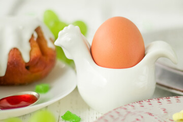 Easter. An egg in a stand on a festive table close up.