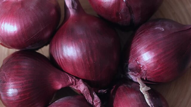 Full Frame Shot Of Purple Onions. Fresh whole onions. Rotation
