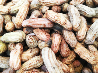 Fototapeta premium peanut in a shell texture. food background of peanuts