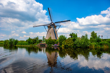 Dutch windmill at Kinderdijk village in South Netherlands - 422223320