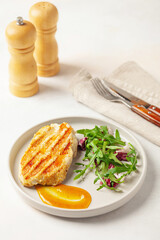 Turkey steak grill with curry sauce and arugula leaves and radichio cabbage. Diet nutrition.