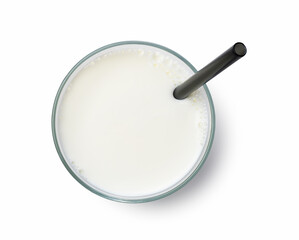 Fototapeta na wymiar Milk in a glass and a straw on a white background.