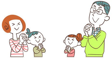 向かい合い、目を瞑って祈る親子
