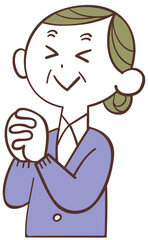 目を瞑って祈るシニアの女性
