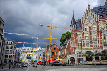 Brussels, Belgium - July 13, 2019: Typical old buildings and construction cranes in downtown Brussels, Belgium - 422224355