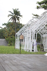 Architecture building beside rice field. Industrial design Indonesia.