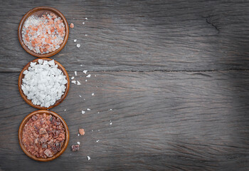 Salt on wooden background