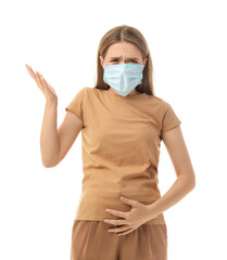 Stressed pregnant woman in medical mask on white background