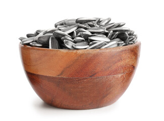 Bowl with sunflower seeds on white background