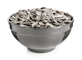 Bowl with sunflower seeds on white background