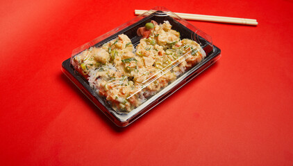 Take out Sushi Volcano Roll on a plastic container