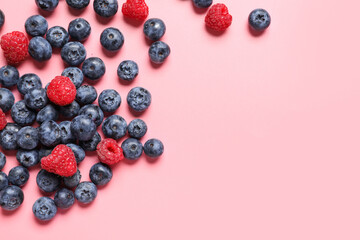 Different fresh berries on color background