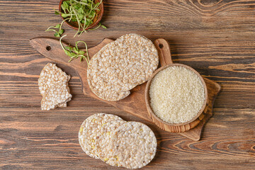 Composition with rice crackers on wooden background