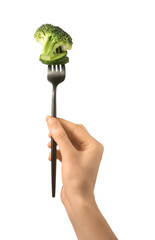 Female hand and fork with broccoli and cucumber on white background