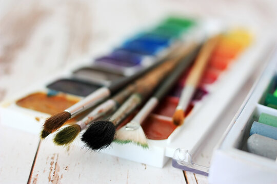 Paints, pastels and brushes for the artist