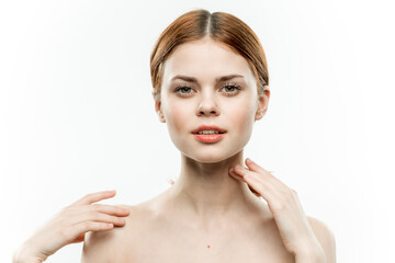 woman holding glamor face attractive look naked shoulders closed eyes