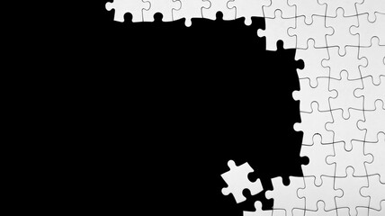 Unfinished white jigsaw puzzle pieces on black background