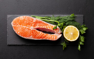 Fresh raw salmon cooking. Fish steak with herbs and spices