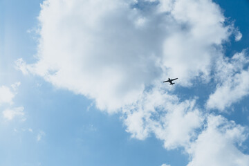 Airplane in the sky on a sunny day.