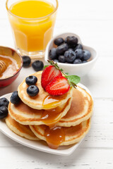 Healthy breakfast with pancakes and orange juice