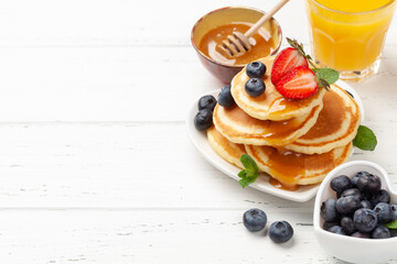 Healthy breakfast with pancakes and orange juice